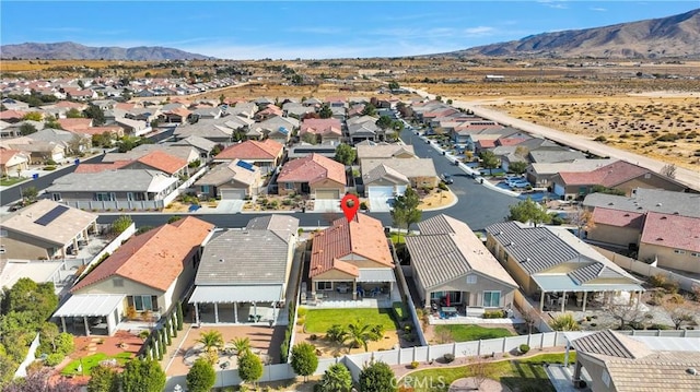 birds eye view of property featuring a mountain view