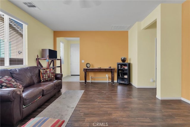 living room with dark hardwood / wood-style floors