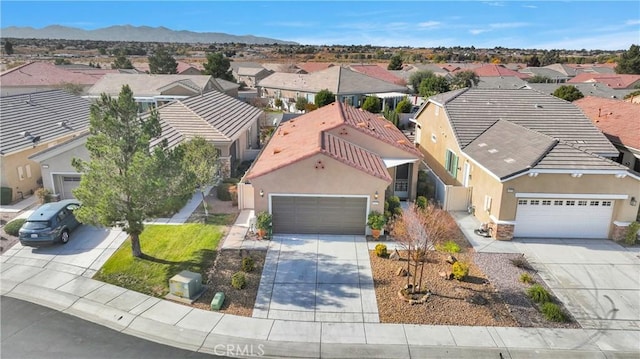 birds eye view of property with a mountain view