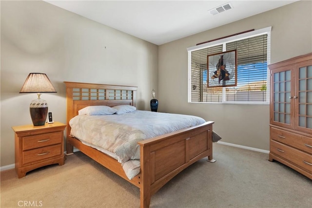 bedroom featuring light carpet