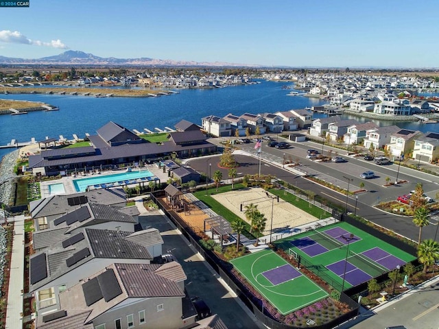 birds eye view of property featuring a water and mountain view