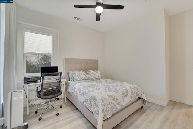 bedroom featuring ceiling fan and light hardwood / wood-style flooring