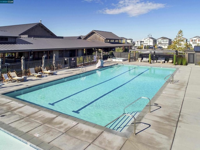 view of swimming pool with a patio area