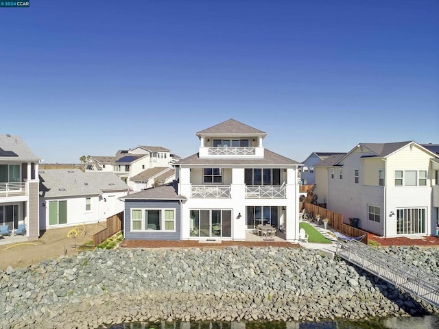 back of house with a balcony