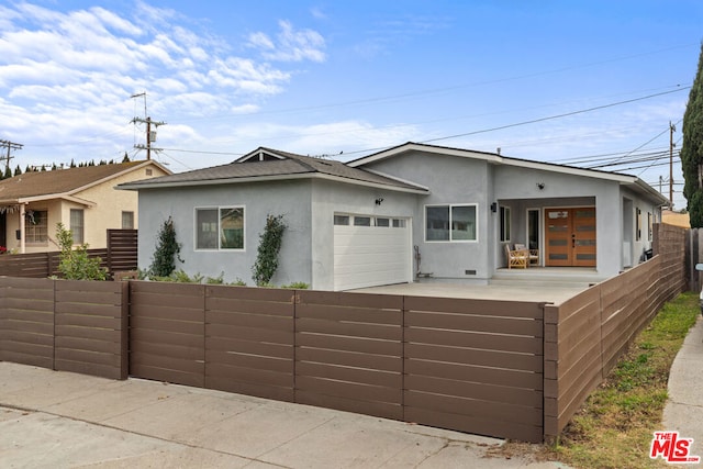 ranch-style house featuring a garage