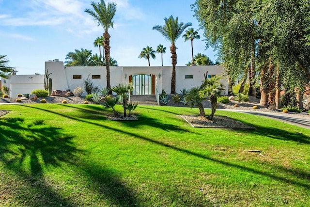 view of front of property with a front lawn