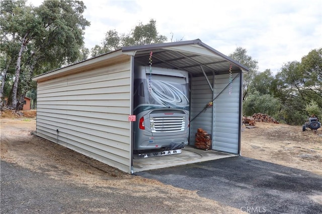 view of outbuilding with a carport