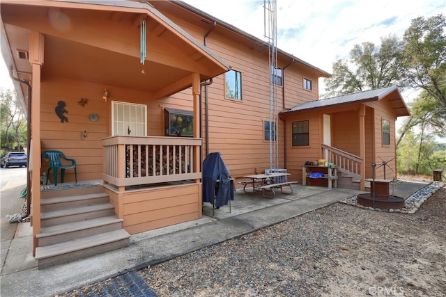 back of property featuring a patio area