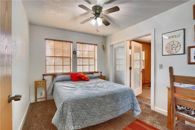 bedroom with carpet flooring, connected bathroom, ceiling fan, and a textured ceiling