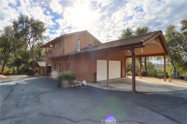 view of property exterior with a garage