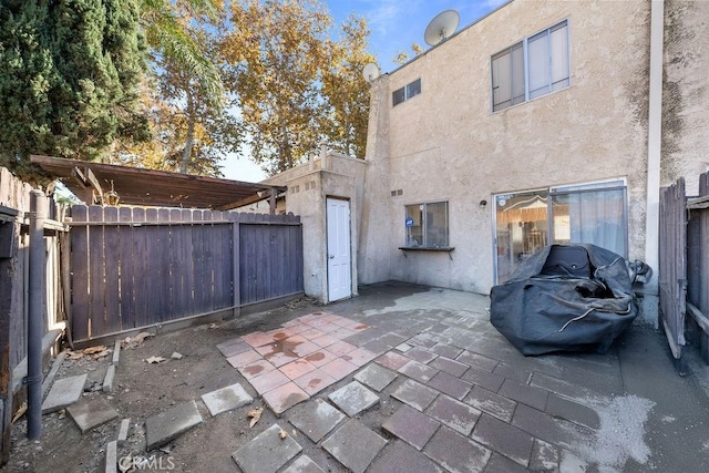 rear view of house featuring a patio area