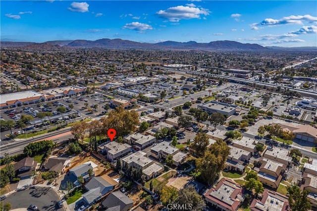 birds eye view of property with a mountain view