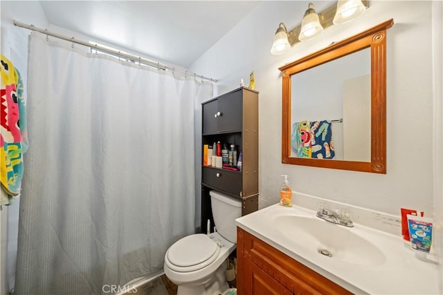 bathroom with a shower with curtain, vanity, and toilet