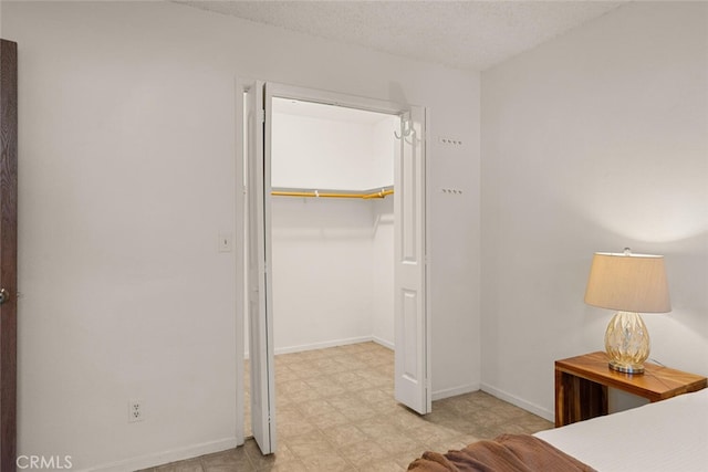 unfurnished bedroom featuring a closet and a textured ceiling