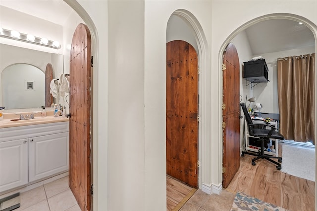 bathroom with wood-type flooring and vanity