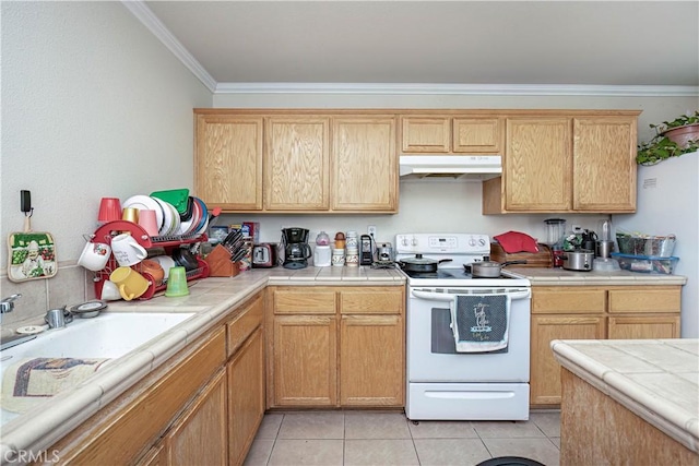 kitchen with electric stove, crown molding, tile counters, and light tile patterned floors