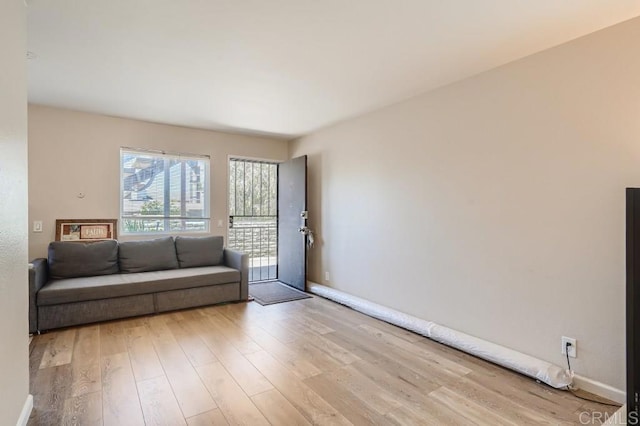 unfurnished living room with light hardwood / wood-style flooring