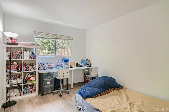 bedroom with light hardwood / wood-style floors