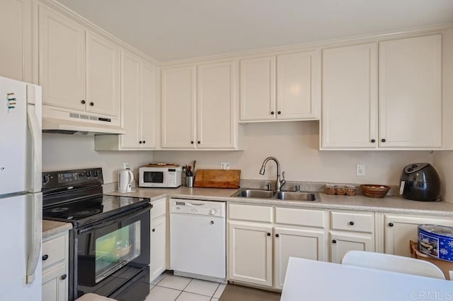 kitchen featuring white cabinets, light tile patterned floors, white appliances, and sink