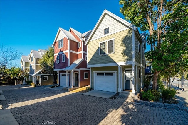 view of front of home with an attached garage and a residential view