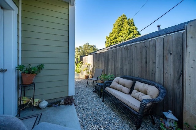 view of patio with fence and an outdoor living space