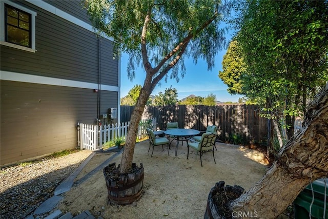 view of patio / terrace with a fenced backyard and outdoor dining space