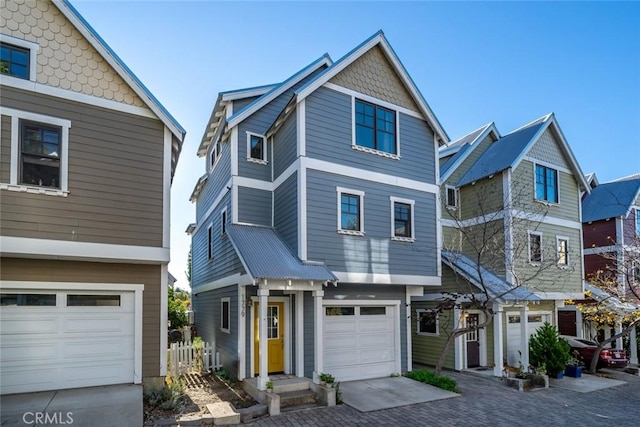 view of front of property featuring driveway and an attached garage