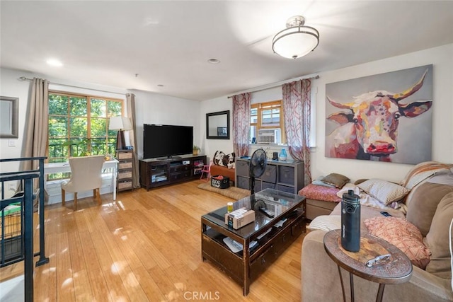 living room featuring cooling unit, wood finished floors, and recessed lighting