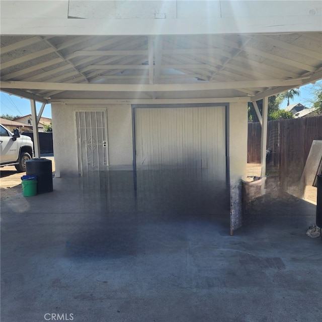 garage featuring a carport