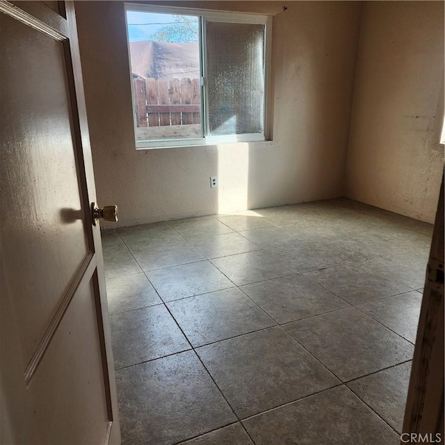 view of tiled spare room