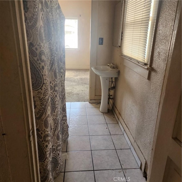 bathroom with tile patterned flooring