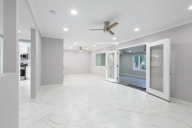 spare room with ceiling fan, french doors, and ornamental molding