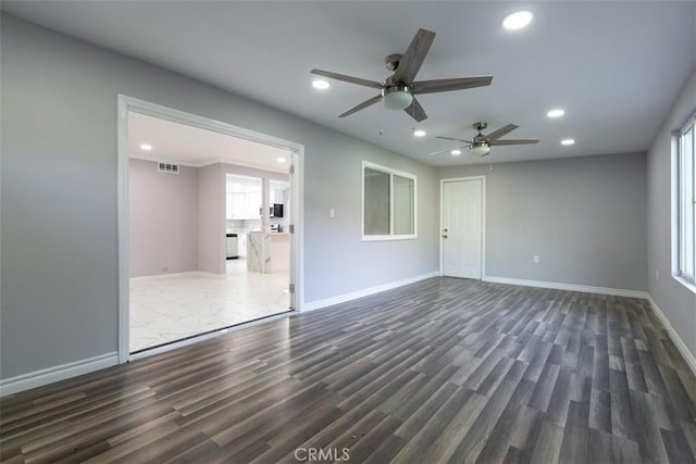 interior space with dark hardwood / wood-style flooring and ceiling fan