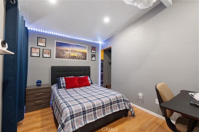 bedroom with light hardwood / wood-style floors