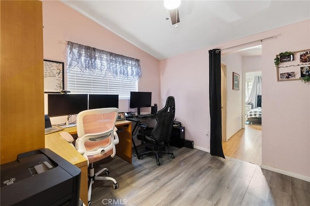 office with hardwood / wood-style floors, ceiling fan, and vaulted ceiling