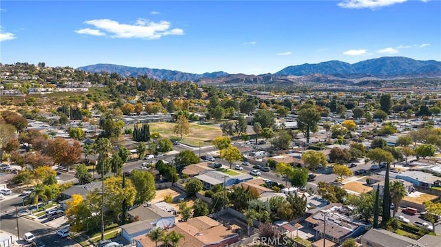 birds eye view of property with a mountain view