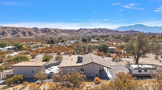 birds eye view of property featuring a mountain view