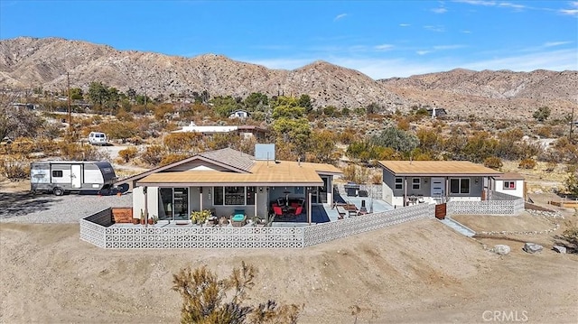 back of house featuring a mountain view