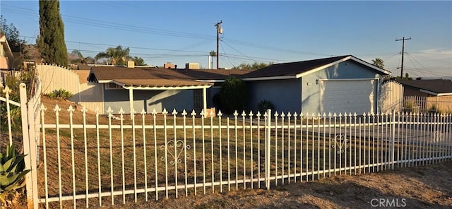 ranch-style house featuring a garage