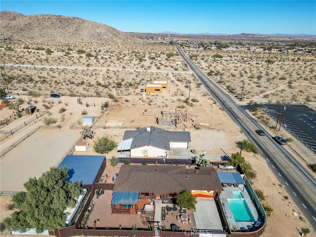 birds eye view of property with a desert view and a mountain view