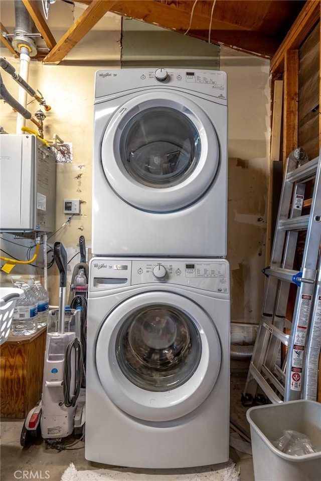 laundry room featuring stacked washer and dryer