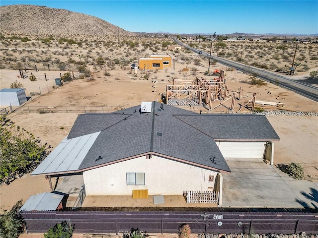 birds eye view of property featuring a mountain view