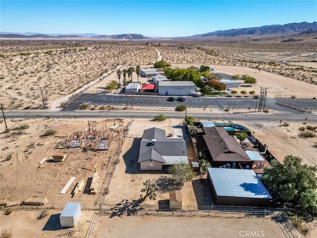 birds eye view of property featuring a mountain view