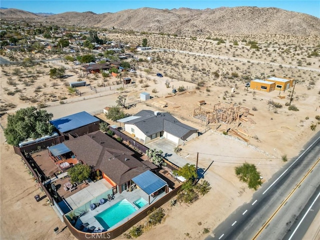 drone / aerial view featuring a mountain view