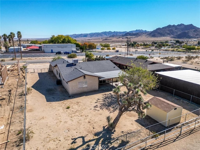 birds eye view of property featuring a mountain view