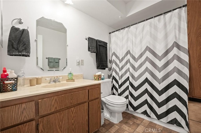 full bath featuring curtained shower, vanity, and toilet