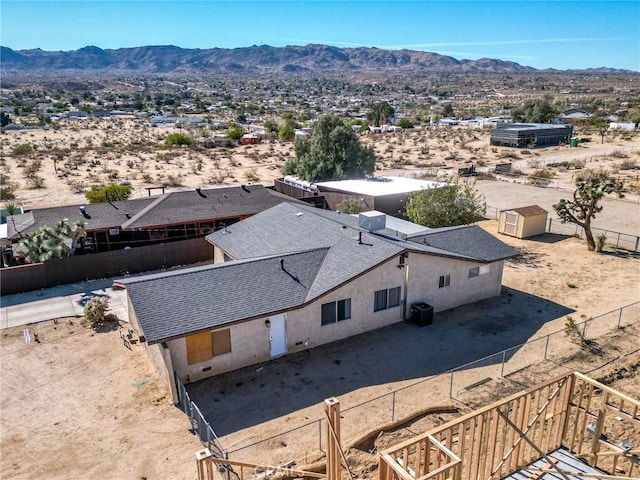 birds eye view of property with a mountain view