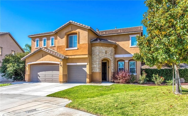 mediterranean / spanish home featuring a front lawn and a garage