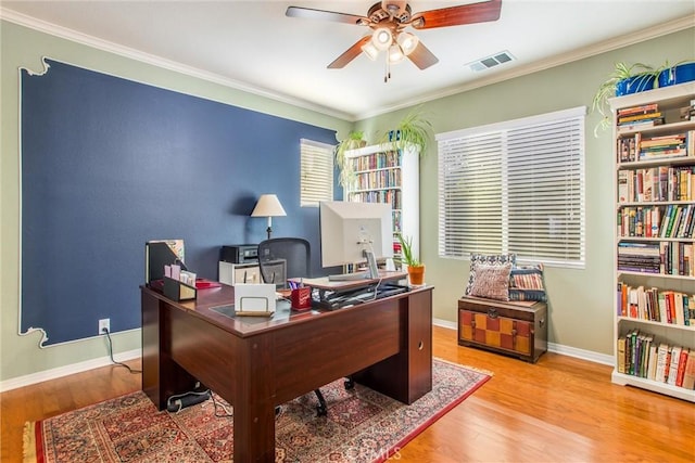 office area featuring ceiling fan, light wood-type flooring, and crown molding