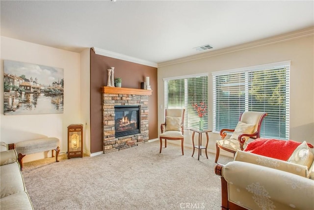 carpeted living room featuring crown molding and a fireplace